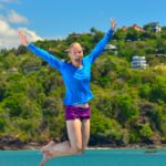 Girl jumping into the water