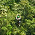 Boy Ziplining through the canopy