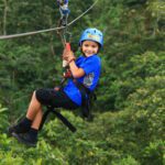 Boy Ziplining in the rainforest