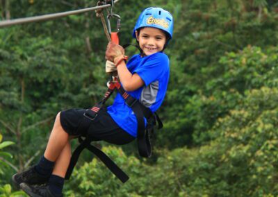 Boy Ziplining in the rainforest