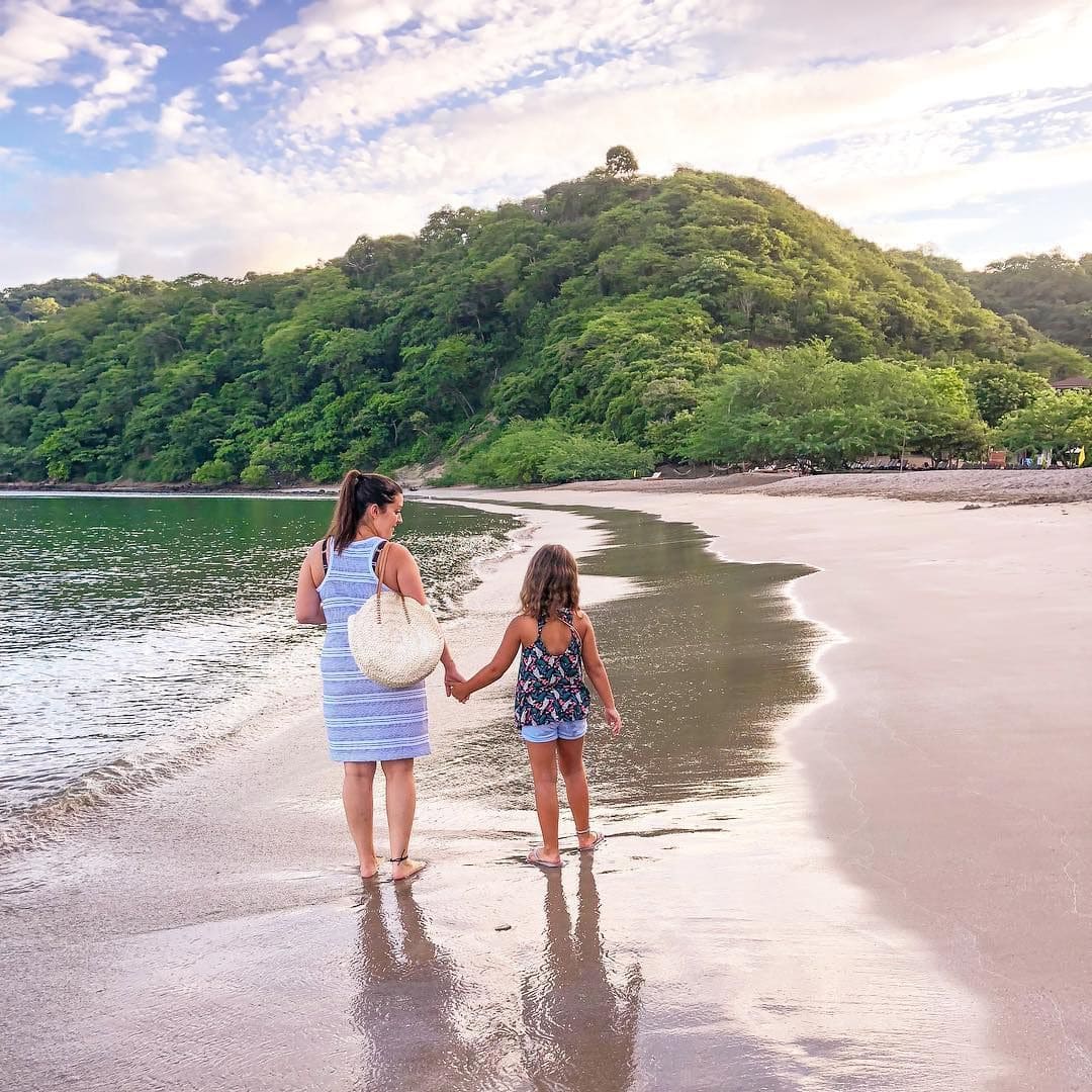 Mom and daughter enyoing the beach and rainforest in Uvita, Costa Rica