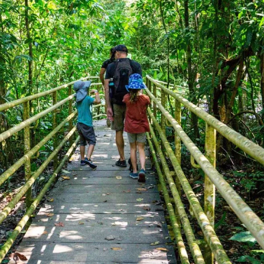 family walking on a trail in Costa Rica