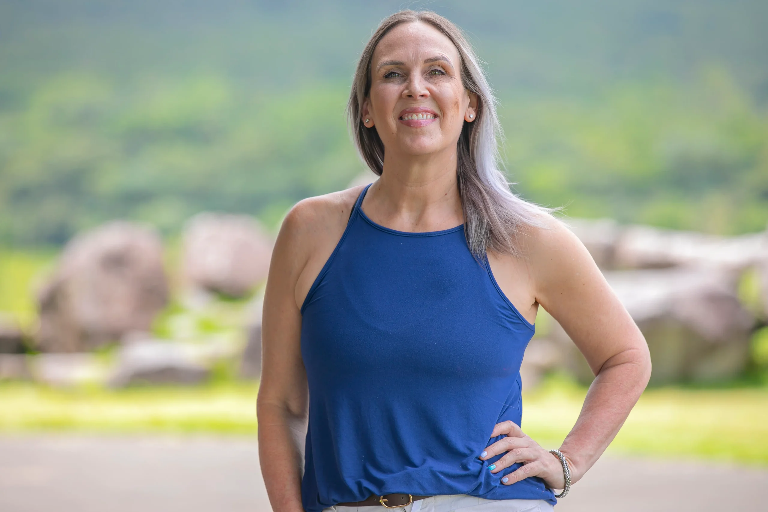 vanessa-ceo-cr4kids-costa-rica.jpg Vanessa, CEO of CR4KIDS, smiling outdoors in Costa Rica with a confident pose.