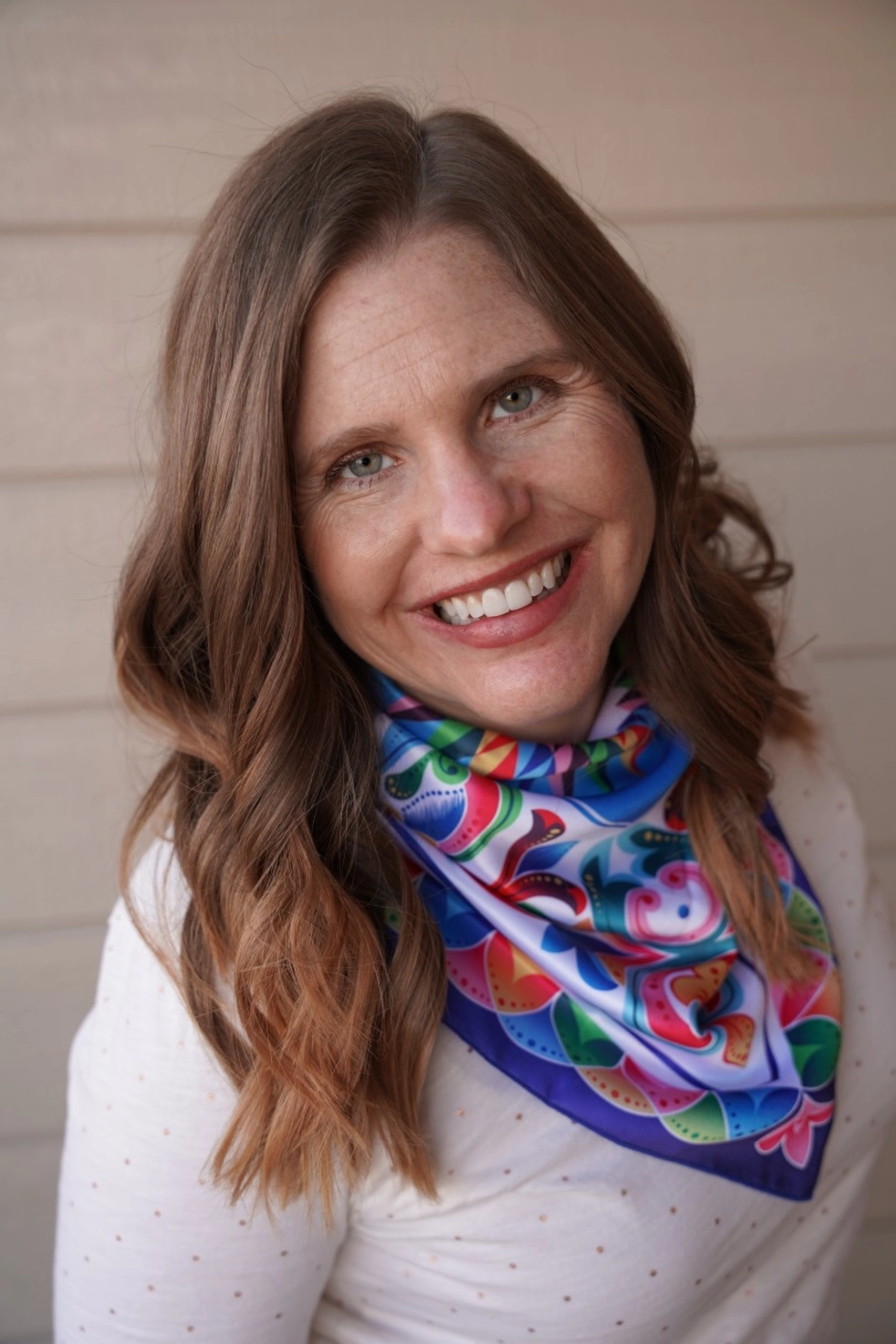 Christa Jimenez smiling, family travel expert and founder of Pura Vida Moms