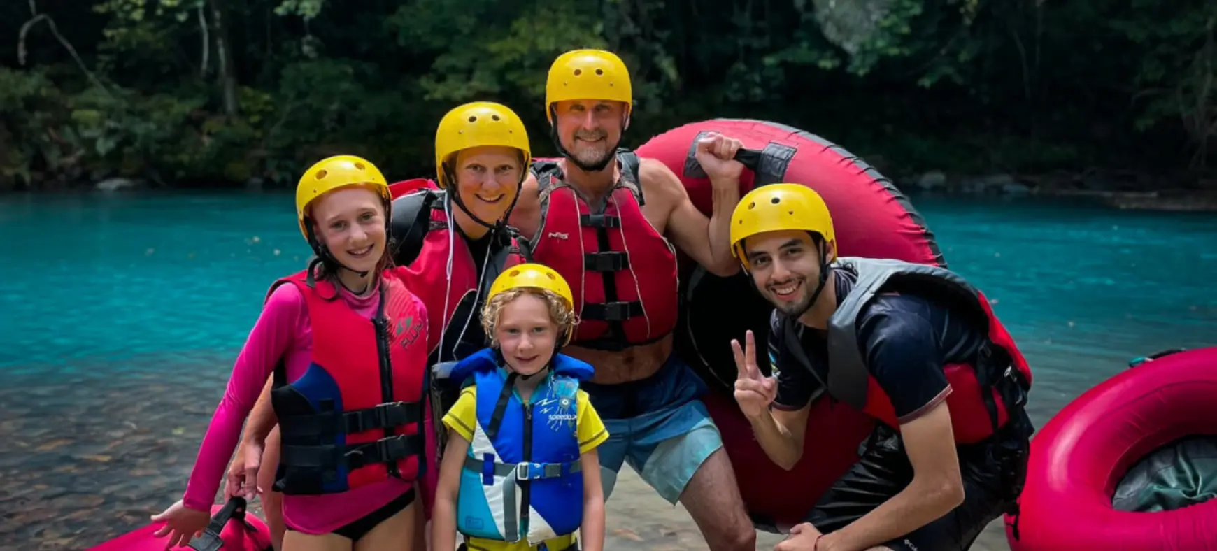 Family group ready for river tubing adventure in Costa Rica
