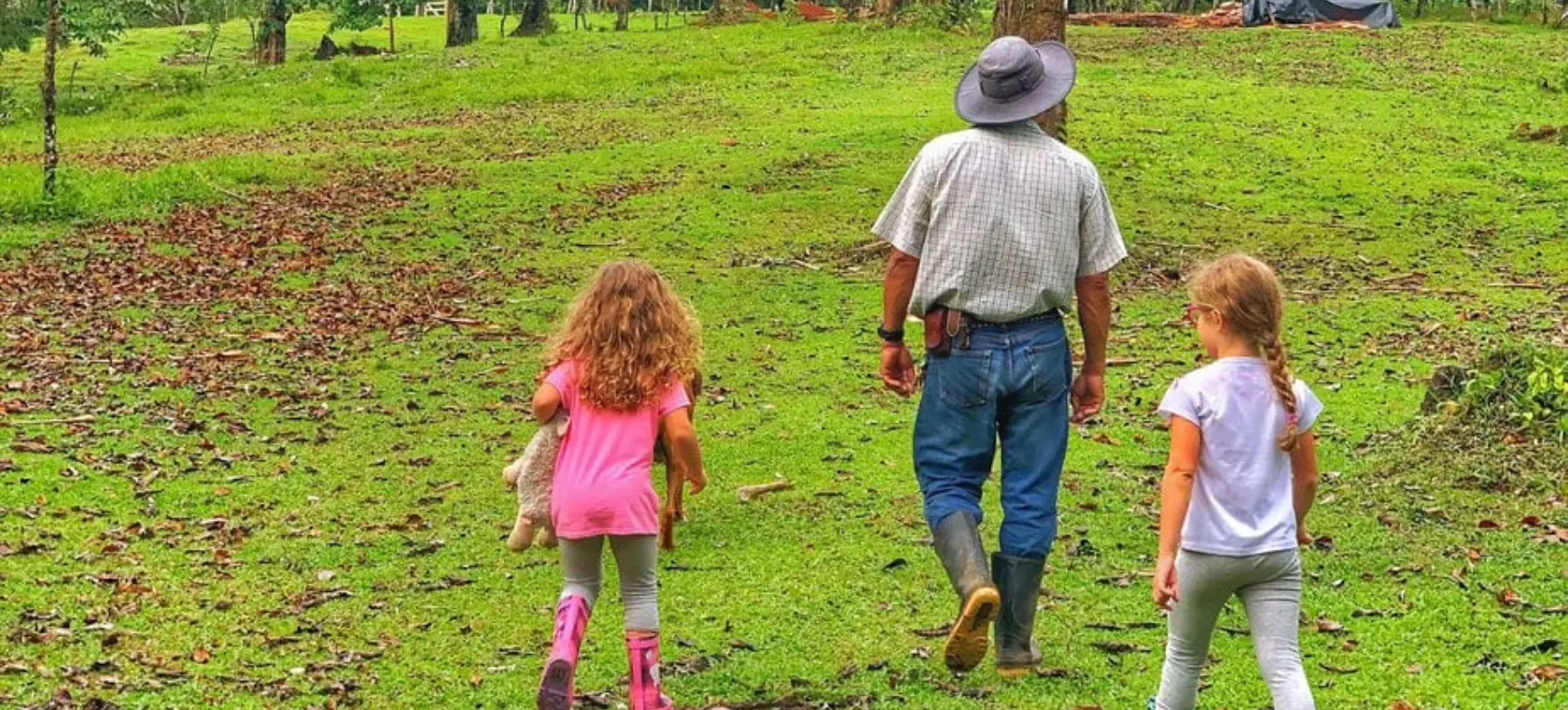 Family with kids walking on an easy nature trail in Costa Rica